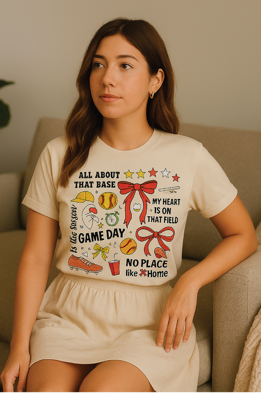 Woman wearing a t-shirt with sports-themed graphics and text.