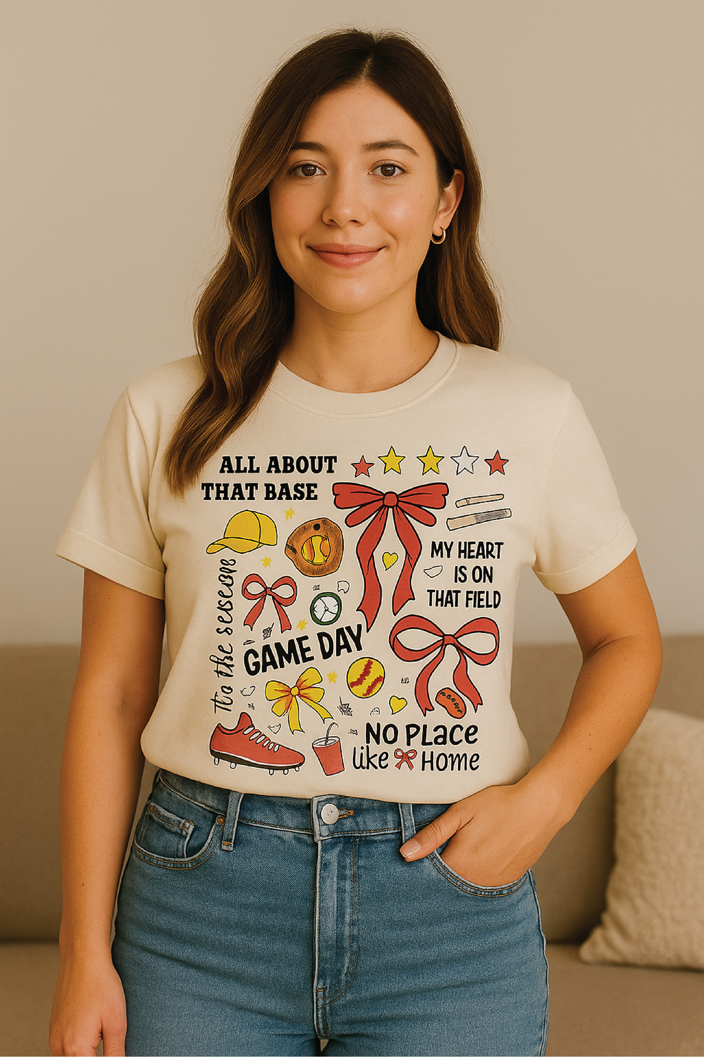 Woman wearing a t-shirt with graphic designs and text, standing against a neutral background.